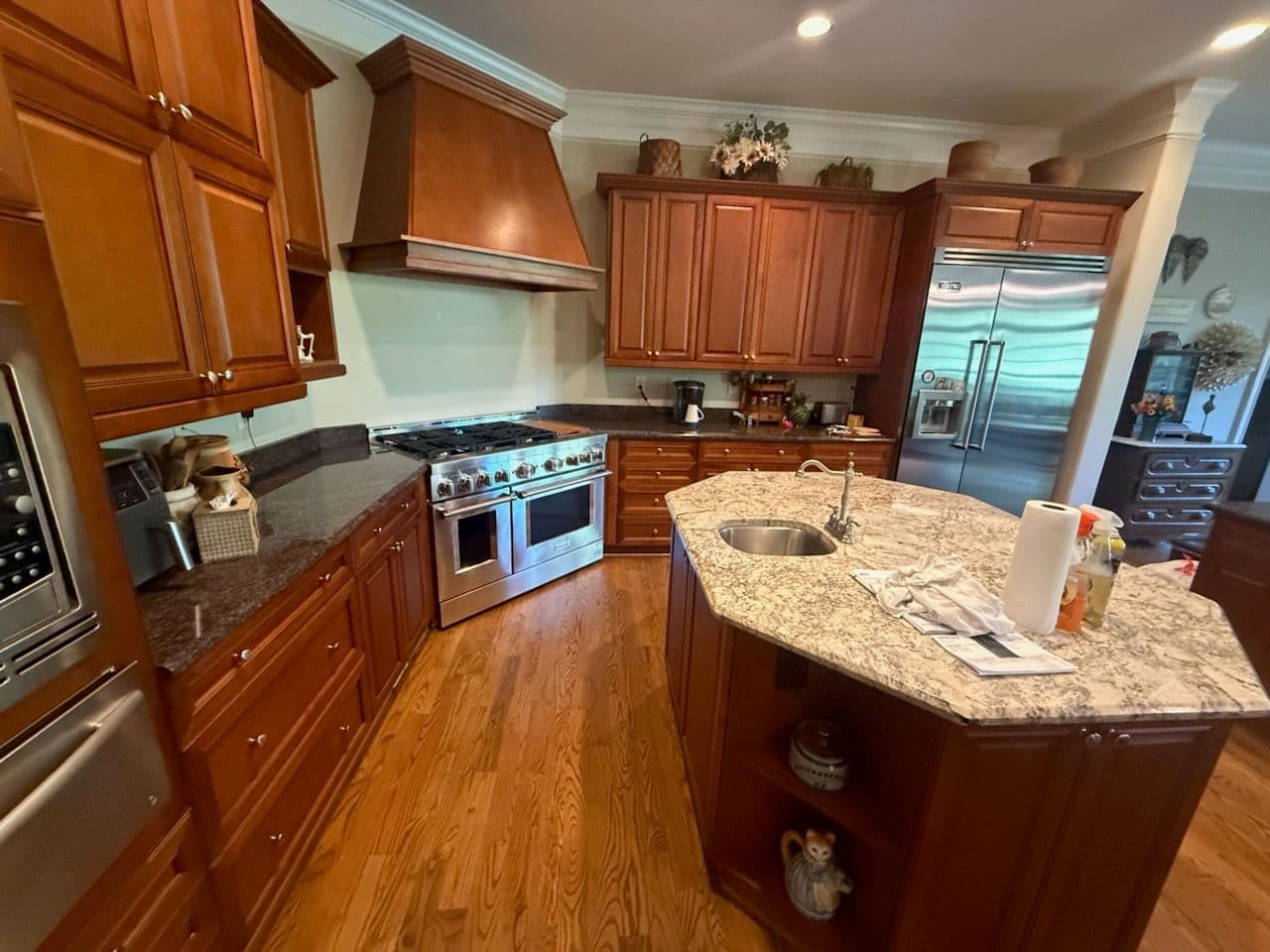 Custom Kitchen Remodel Featuring Rich Wooden Cabinetry and Granite Countertops