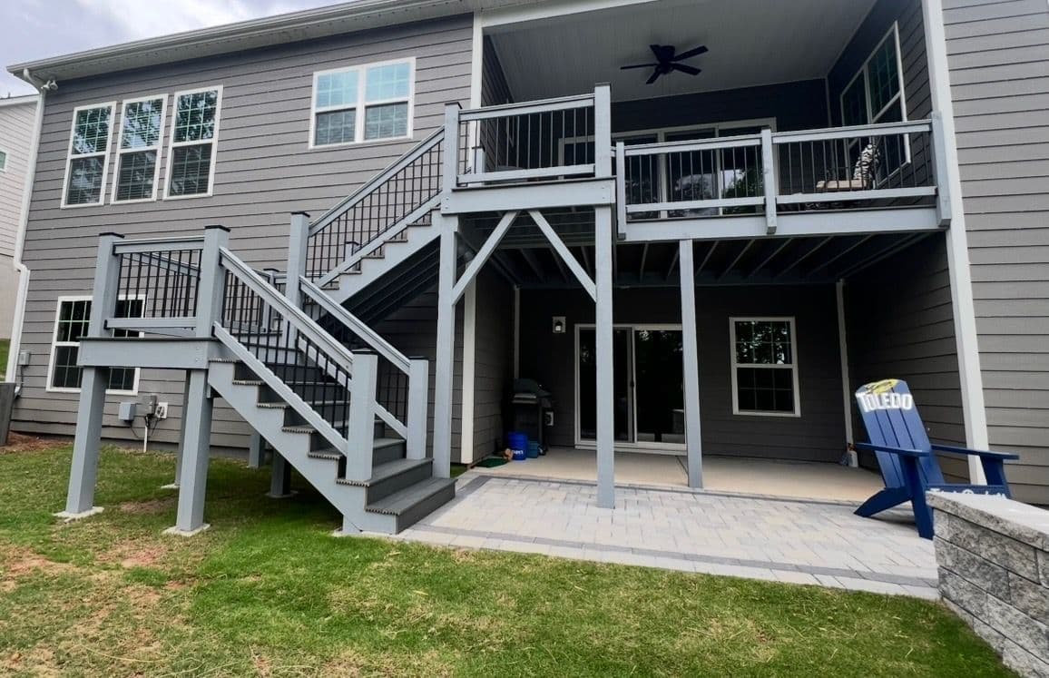 Project Two-Level Deck Masterpiece with Gray Wood and Black Railings image