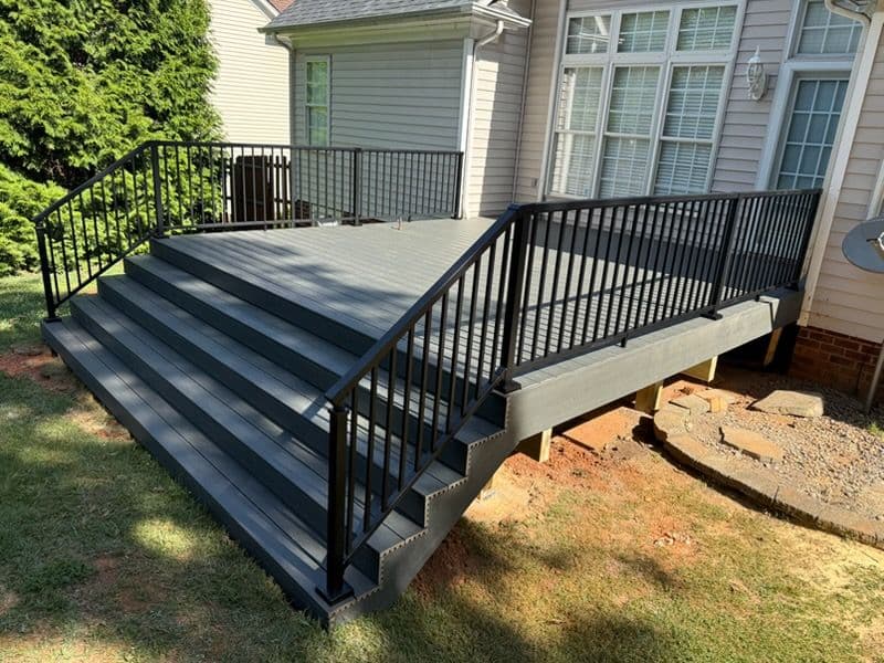 Custom Composite Deck Build with Black Metal Railings image