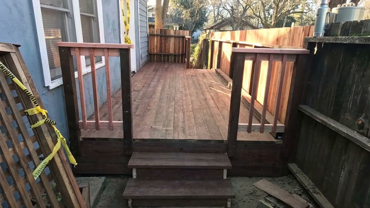Finished cedar side-yard deck with railings and stairs, built by Berg Custom Builds in the Charlotte metro